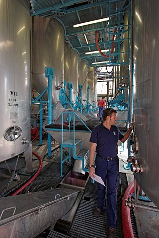 Philip Lawrence inspecting fermentation tanks at the   Mercs winery of the Madeira Wine Company Funchal   Madeira Portugal