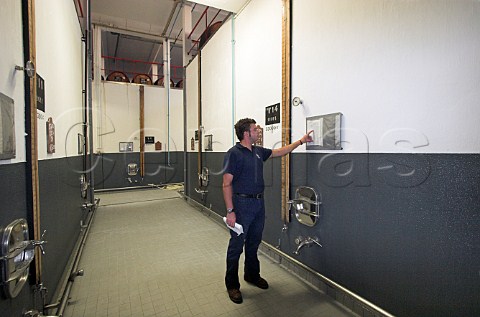 Philip Lawrence inspecting estufa tanks where Tinta   Negra Mole wine is heated to about 50C to speed its   ageing process at the Mercs winery of the Madeira   Wine Company Funchal Madeira Portugal
