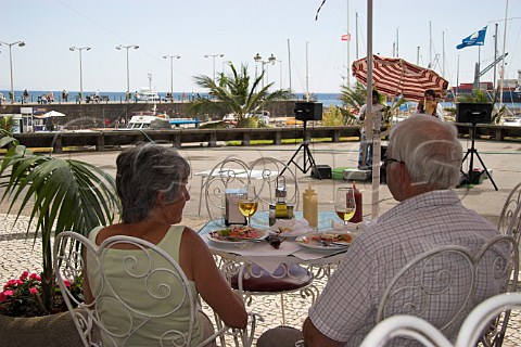 Couple enjoying lunch by the harbour Funchal   Madeira Portugal