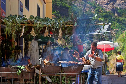 Barbequeing chicken during a festival at Curral das   Freiras Madeira Portugal