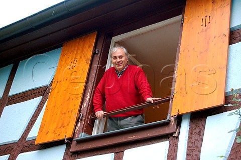 Jean Meyer in the courtyard window of his Josmeyer   winery Wintzenheim Alsace HautRhin France