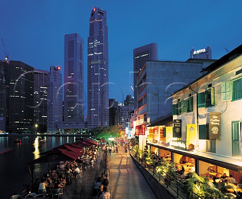 Outdoor dining along Singapore River at dusk   Singapore