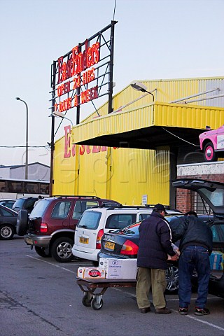 British shoppers loading wine and beer into their   car outside one of the many wine supermarkets in   Calais  NordPasdeCalais France