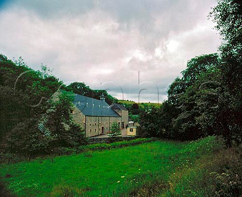Dufftown Distillery nestling in the Dullan Water   valley to the south of Dufftown  Banffshire   Scotland Speyside