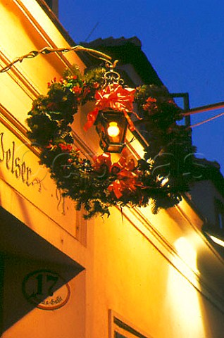 Green wreath hanging over the doorway to   identify a Heurigen wine tavern    Vienna Austria