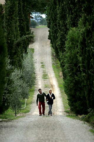 Nicolo De Ferrari Corradi and his mother Paola De Ferrari Corradi walking up the road at Poderi   Boscarelli Cervognano Montenero Tuscany Italy     Vino Nobile di Montepulciano