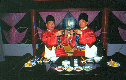 Toasting at a banquet with Mao Tai a   strong rice wine  China