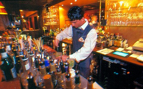 Barman mixing cocktail at the Four   Seasons Hotel Hamburg Germany