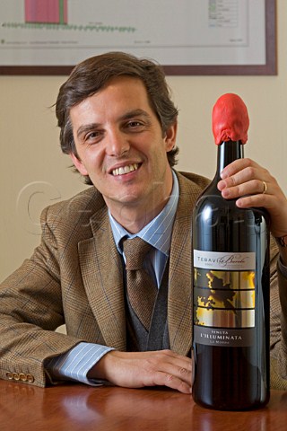 Guido Folonari with bottle of Barolo Tebavio    Tenuta LIlluminata La Morra Piemonte Italy