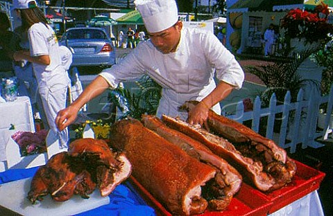 Preparing roast suckling pig for   openair buffet Hong Kong