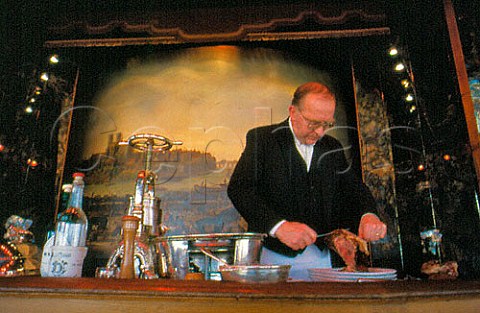 Canardier Alain Retif carving duck in   La Tour DArgent restaurant   Paris France