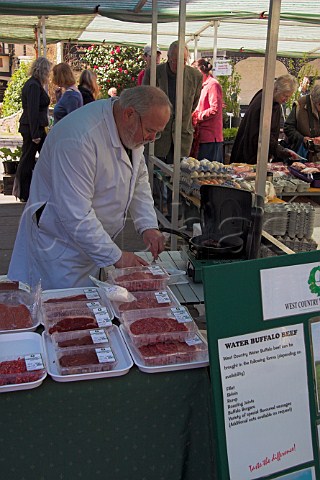 Preparing packs of Water Buffalo Beef on a stall at   Wells Market Somerset England