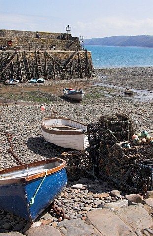 Fishing boats and lobster pots Clovelly harbour   North Devon England