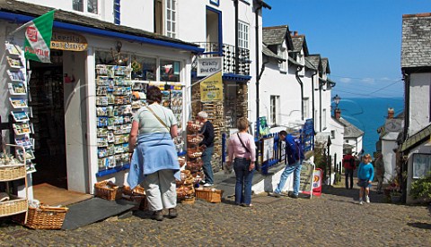 Tourists in the steeply cobbled main street   Clovelly North Devon England