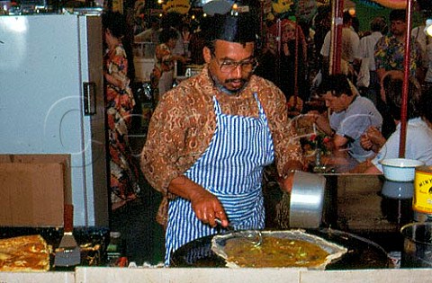 Making Martabak Manis with eggs leeks   and goatmeat  Annual Indonesian market   Den Haag Netherlands