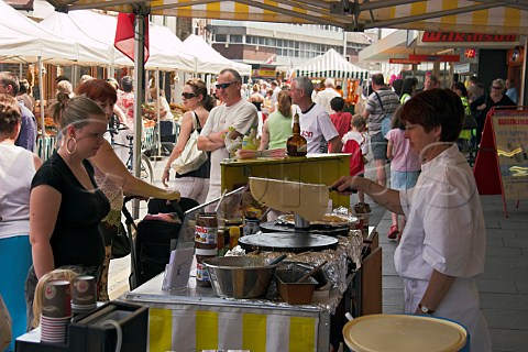 Making traditional Breton crpes at the French   Market WaltononThames Surrey England