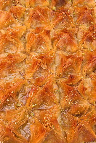 Turkish baklava desserts filo pastry with syrup and  nut filling on sale at the French Market  WaltononThames Surrey England