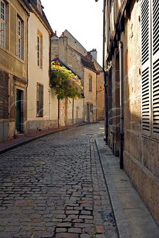 Quiet back street with spring colour in   Beaune Cte dOr Burgundy France