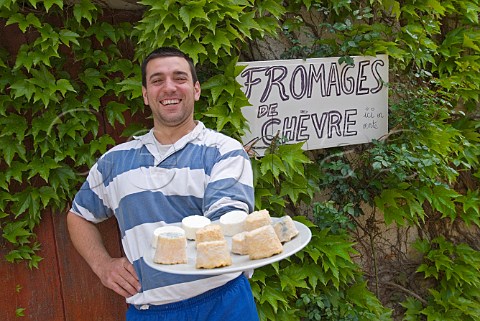 Cheesemaker Emmanuel Plait showing off a variety of   his Fromage de Chvre outside his Chvrerie des Hautes Ctes Echevronne Cte dOr France
