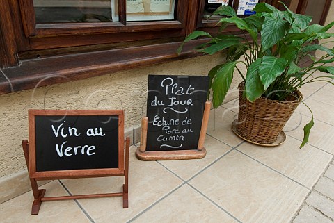 Mini blackboard signs outside French restaurant   promoting wine by the glass and the dish of the day   Cte dOr France