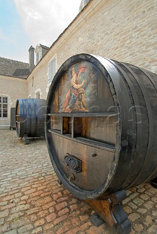 Old wine barrels with painted motifs and carvings in   the courtyard of Chteau de Pommard Cte dOr   France Cte de Beaune