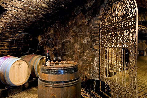 The ancient vaulted cellar of Chteau de Pommard with 300year old wroughtiron gate Pommard Cte dOr France Cte de Beaune