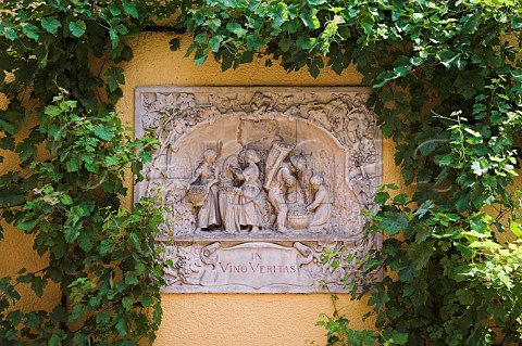 In Vino Veritas relief of grape pickers on the   wall of Weingut Milz Lautentiushof Trittenheim   Germany  Mosel