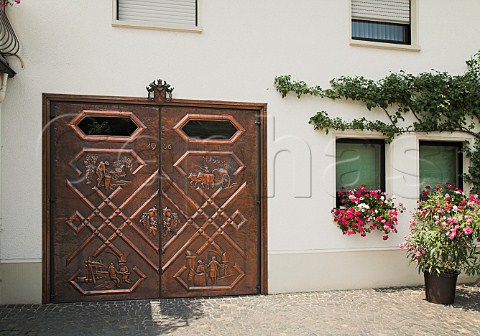 Decorative cellar doors at Weingut Ernst Clsserath  Trittenheim Mosel Germany