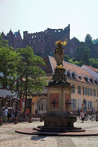 Statue of Madonna and Child in the Kornmarkt with   Heidelberg castle beyond  Heidelberg   BadenWrttemberg Germany