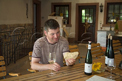 KlausPeter Keller winemaker and manager with a   sample of limestone from his vineyard Weingut   Keller FlorsheimDalsheim Germany  Rheinhessen