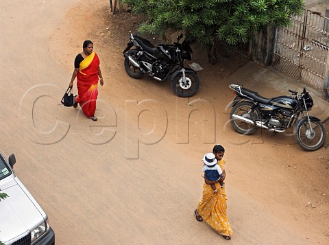 Indian women walking along road Chennai Madras   India
