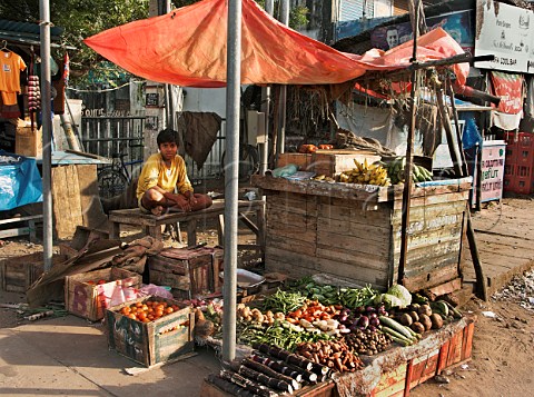 Young boy on fruit and vegetable stall Chennai   Madras India