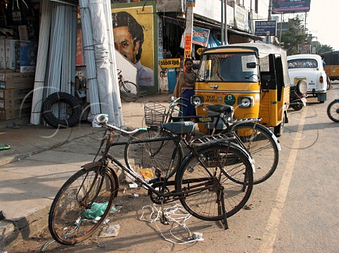 Bicycles Autos and cars line the street Chennai   Madras India