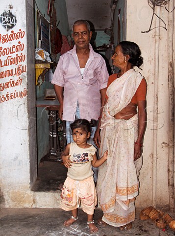 Indian tailors family in doorway of shop Chennai   Madras India