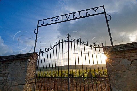 Wroughtiron gate entrance to the J Faiveley parcel   of Clos de Vougeot vineyard at sunset Cte dOr   France  Cte de Nuits