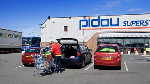 British shoppers loading wine and beer into their   cars outside one of the many wine and beer   supermarkets in Calais NordPasdeCalais France