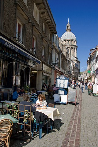 Terrace tables outside the many cafs and   restaurants on Rue de Lille in the old quarter of   Boulogne PasdeCalais France