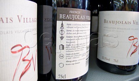 Bottles of Beaujolais Villages wine on sale in a UK   supermarket with sweetdry grading system
