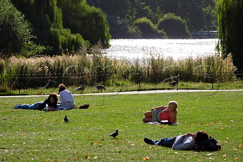Office workers relaxing in St Jamess Park London