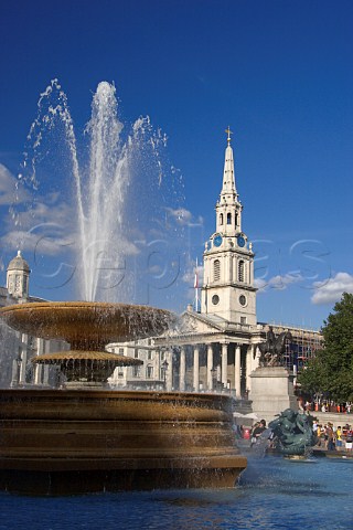 Fountain in Trafalgar Square the spire of St   MartinsintheFields behind London
