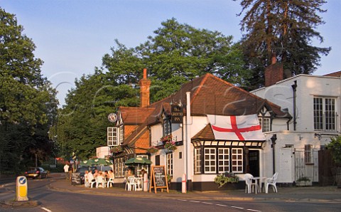 People drinking outside the Grotto pub Weybridge   Surrey England