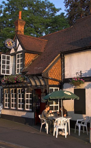 People drinking outside the Grotto pub Weybridge   Surrey England