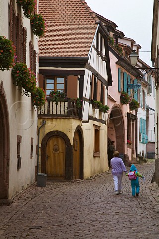Narrow street in Gueberschwihr HautRhin France    Alsace