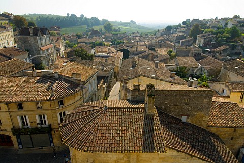 View to vineyards over terracotta tiled rooftops of   Stmilion Gironde France Bordeaux