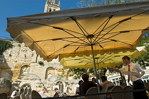 Alfresco dining on a sunny day in the main square of   Stmilion Gironde France