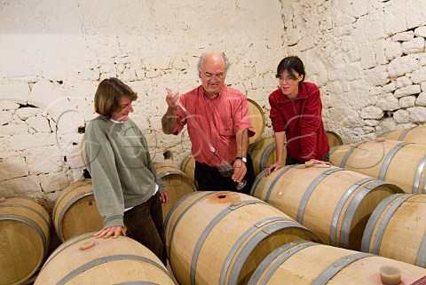 Caroline Michel and Marina Gracia taking a sample   from barrel in the garage cellar of Gracia   Saintmilion Gironde France  Stmilion    Bordeaux