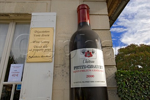 Large display bottle of Chteau PetitGravet outside   the chteau wine shop inviting wine tasting   Stmilion Gironde France
