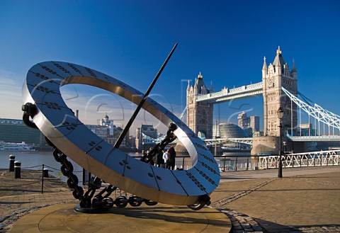 Sundial at St Katharines Dock with Tower Bridge behind London