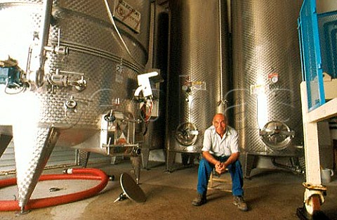 Giovanni Cherchi among steel fermenting tanks at Cherchi Giovanni Maria Usini Sardinia Italy