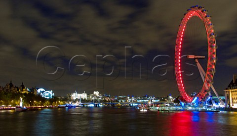 River Thames and the London Eye observation wheel at night London England